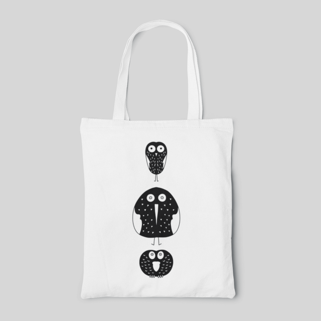 white designed tote bag with 3 chumpy cartoon birds, front side