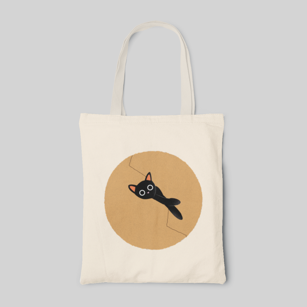 minimalist designed tote bag with a cute cartoon black cat inside a light brown circle, front side