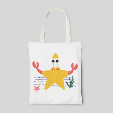 White designed tote bag with abstract yellow starfish, front side