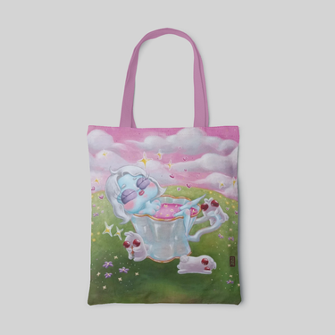 vivid colour lowbrow designed tote bag with blue alien in cup on green grass with pink skies, front side