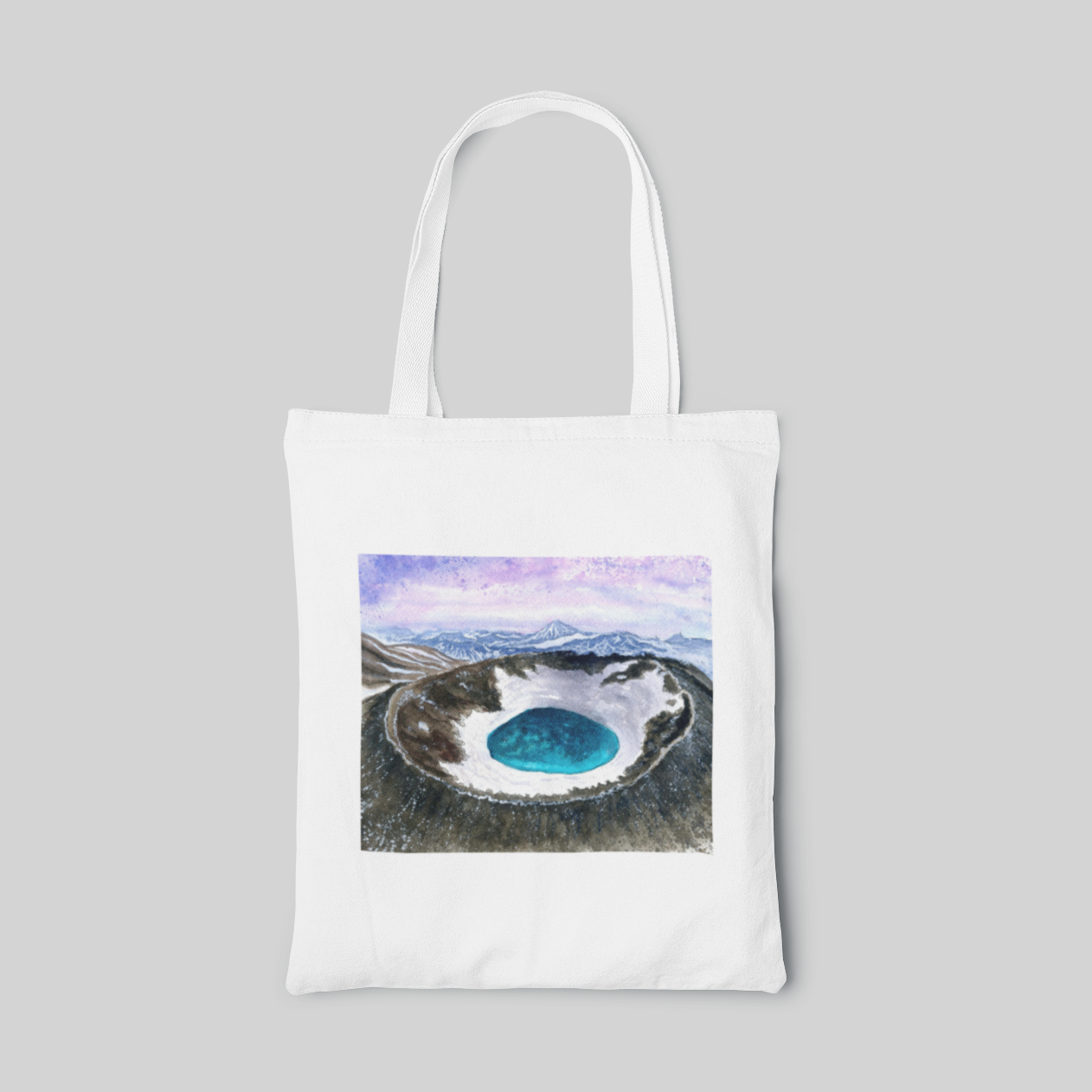 White natural designed tote bag with a volcano landscape inside, front side
