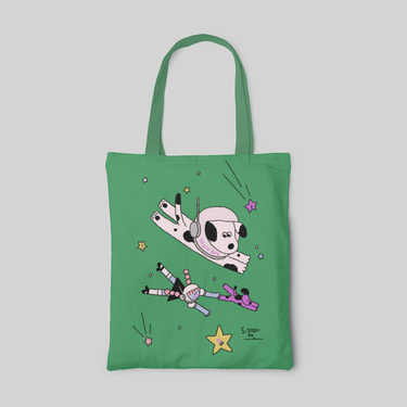a lowbrow designed green tote bag with a girl and two dog traveling in space, and some stars surround, front side