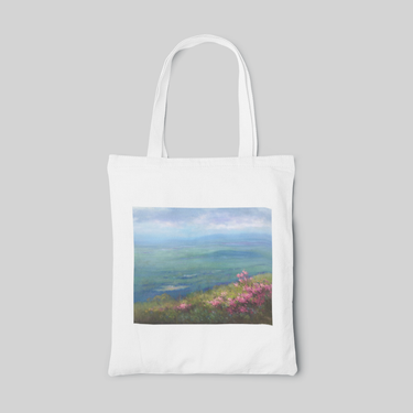 White oil painting designed tote bag with ocean landscape and pink flowers in grasses, front side