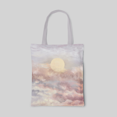 nature designed tote bag with sunset of pink and white clouds surrounding the sun, front side