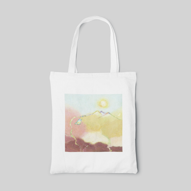 designed white tote bag with abstract pink blue yellow and brown gradient base, and yellow and blue line of mountain and bird, front side