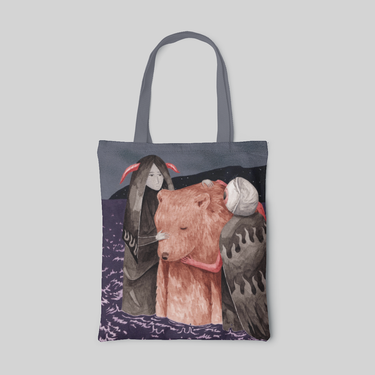 Grey lowbrow designed tote bag with monochrome girl in red horns and a eye ball with red hands hugging a brown bear, front side