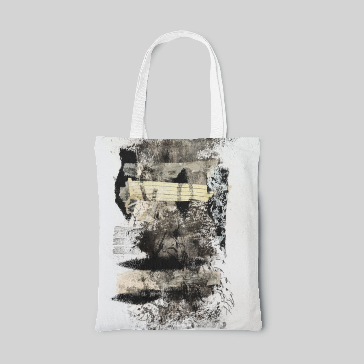white abstract designed tote bag with a collage with various self-made papers, stamps, textures, ink painting and coffee extract to represent the dazzling Earth, front side