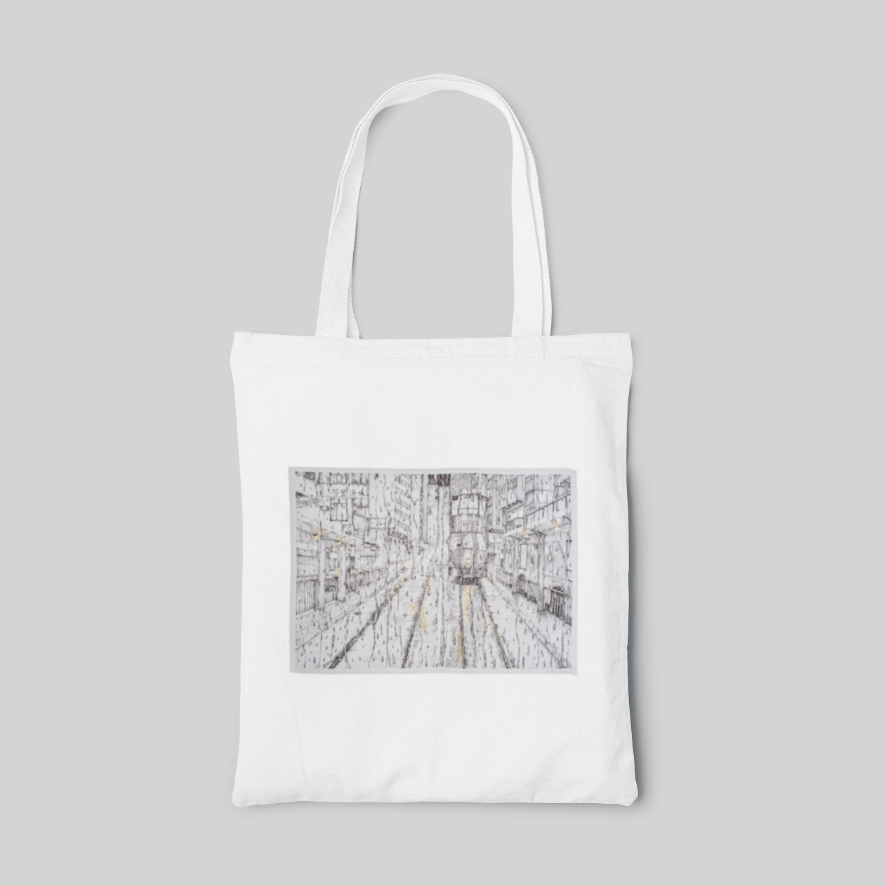 White tote bag with monochrome line drawings of city 