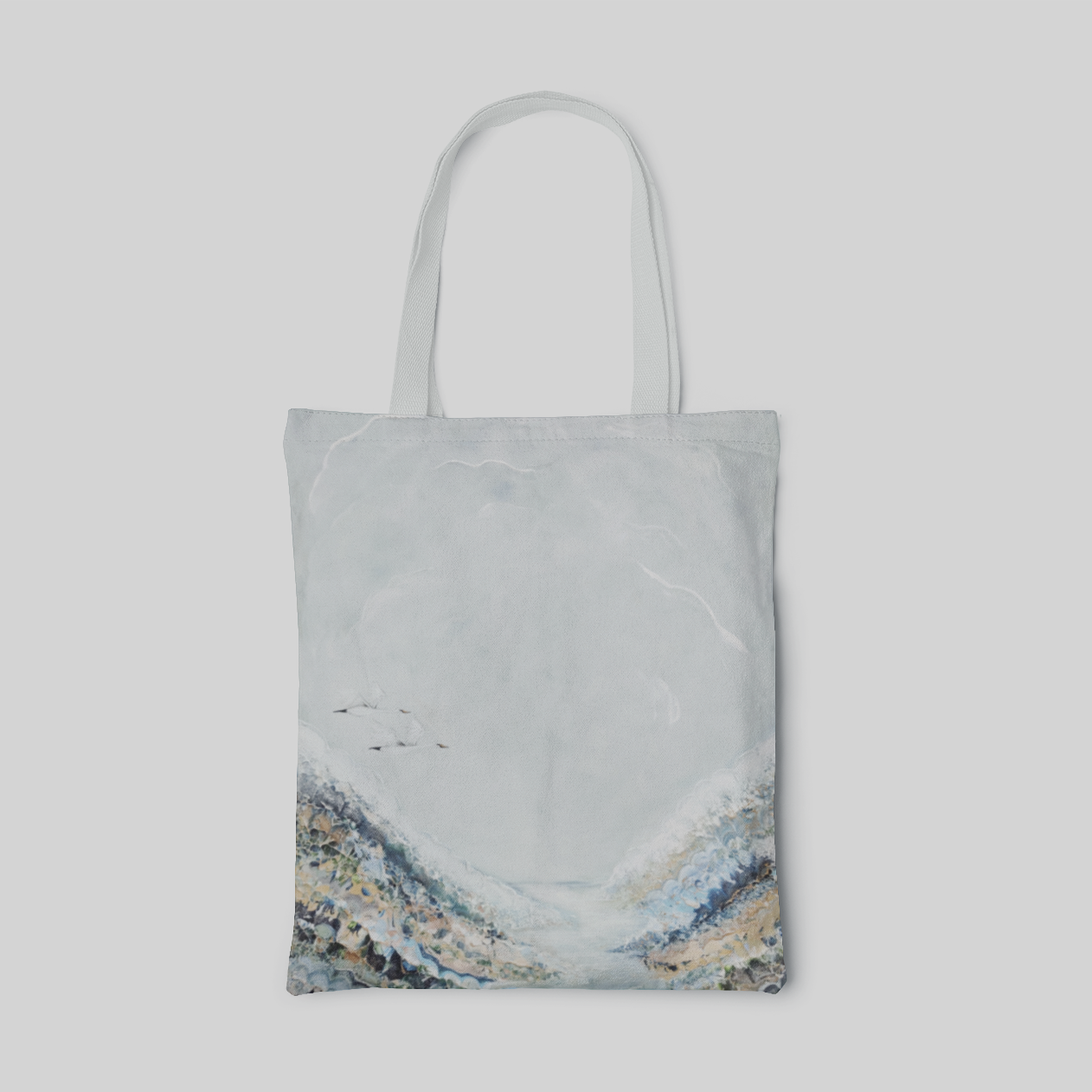 light blue abstract designed tote bag with a pair swans flying in the sky, front side